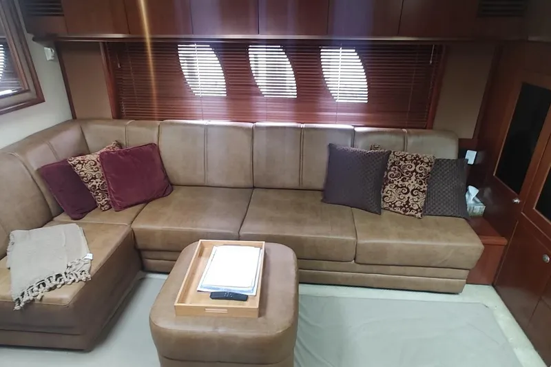 Slide: The Image of Luxurious interior of 2006 Sea Ray 48 Sundancer yacht with plush seating and elegant decor. - 12