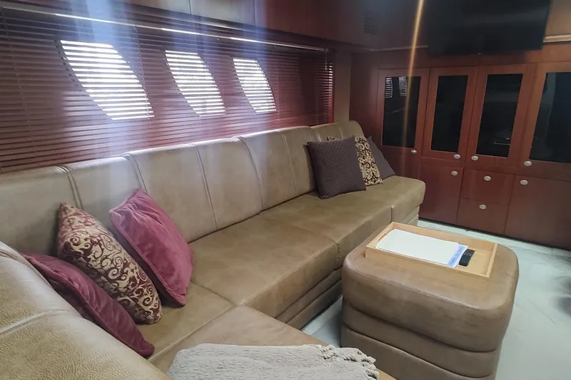 Slide: The Image of Luxurious interior of 2006 Sea Ray 48 Sundancer yacht with plush seating and elegant decor. - 13