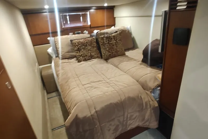 Slide: The Image of Luxurious cabin interior of 2006 Sea Ray 48 Sundancer yacht with cozy bedding. - 20