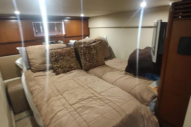 Slide: The Image of Luxurious cabin interior of 2006 Sea Ray 48 Sundancer yacht with cozy bedding. - 22