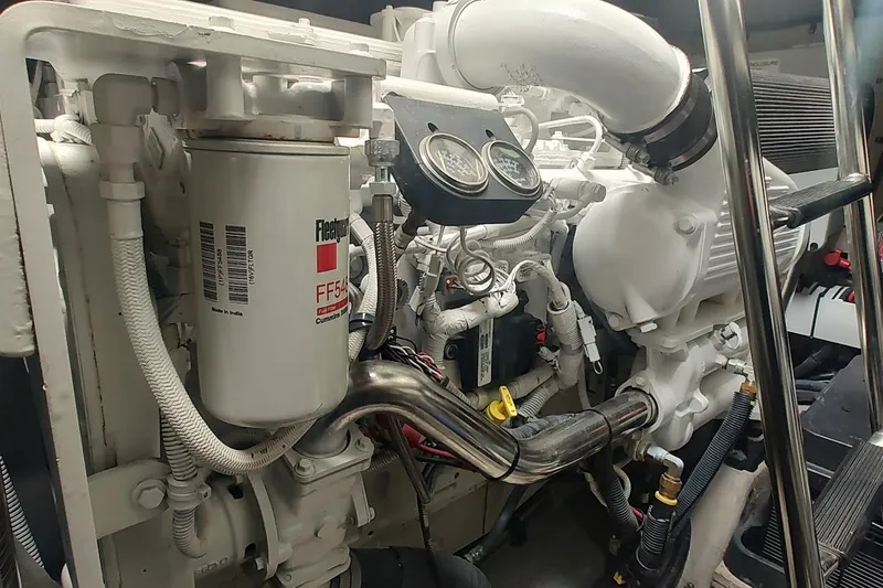 Slide: The Image of Engine compartment of a 2006 Sea Ray 48 Sundancer, featuring detailed mechanical components. - 26