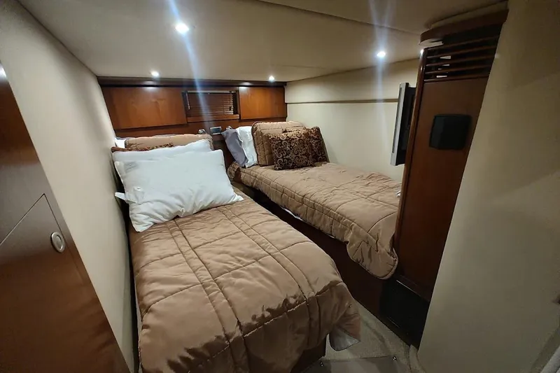 Slide: The Image of Luxurious twin cabin interior of 2006 Sea Ray 48 Sundancer yacht. - 35