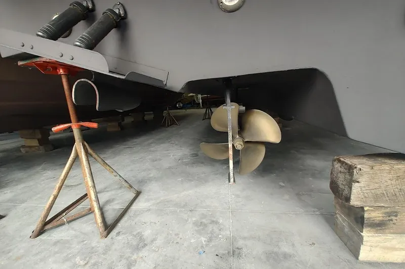 Slide: The Image of 2006 Sea Ray 48 Sundancer boat propeller and hull on dry dock. - 38