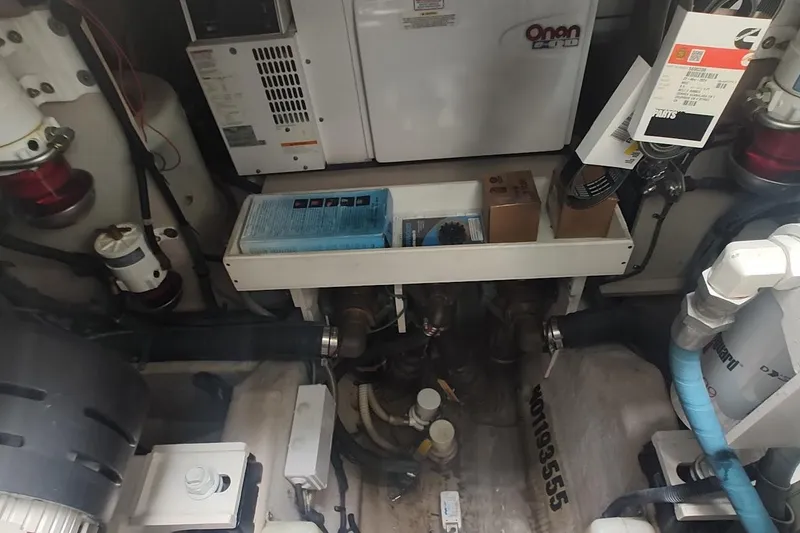 Slide: The Image of Engine room of a 2006 Sea Ray 48 Sundancer with Onan generator and various components. - 42