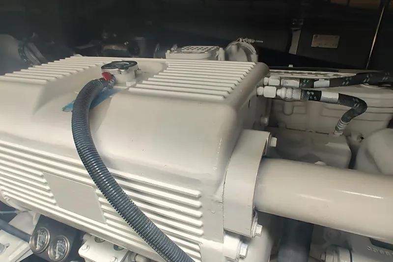 Slide: The Image of Engine compartment of a 2006 Sea Ray 48 Sundancer yacht, showcasing mechanical components. - 44