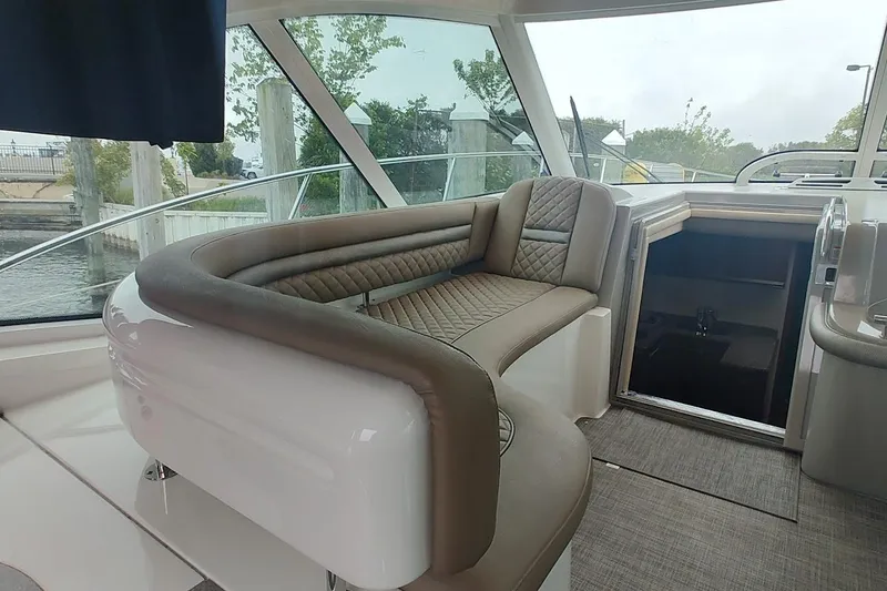 Slide: The Image of 2006 Sea Ray 48 Sundancer interior with elegant seating and panoramic windows. - 7