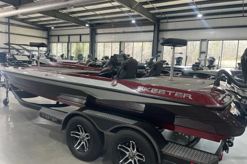 The Image of 2022 Skeeter ZXR21 bass boat in showroom, featuring sleek design and modern features. - 0