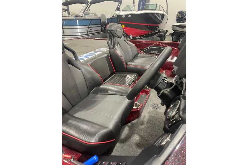 Slide: The Image of Interior of 2022 Skeeter ZXR21 boat with black and red seating. - 15