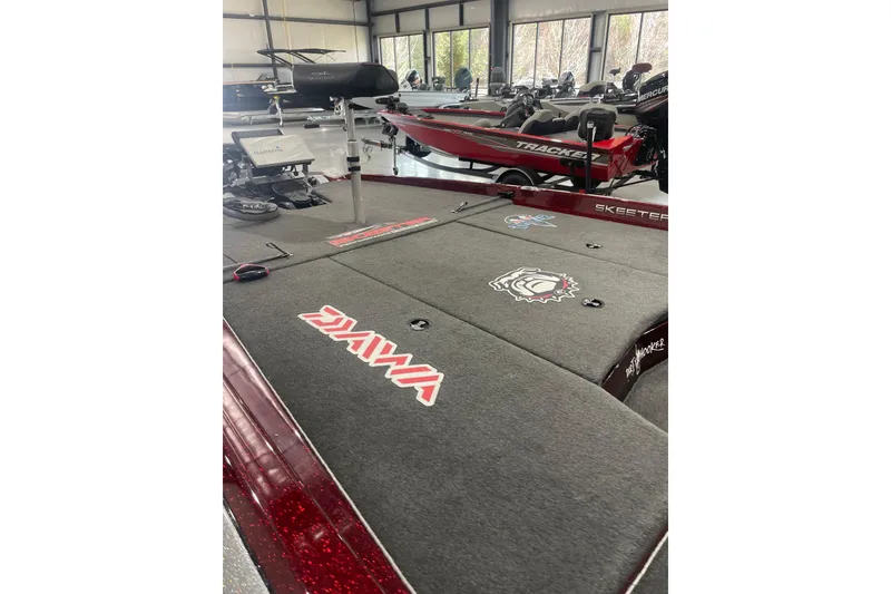 Slide: The Image of 2022 Skeeter ZXR21 fishing boat interior with branded carpet and equipment. - 17