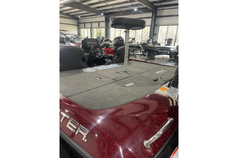 Slide: The Image of 2022 Skeeter ZXR21 boat interior with fishing deck and seat in showroom. - 4
