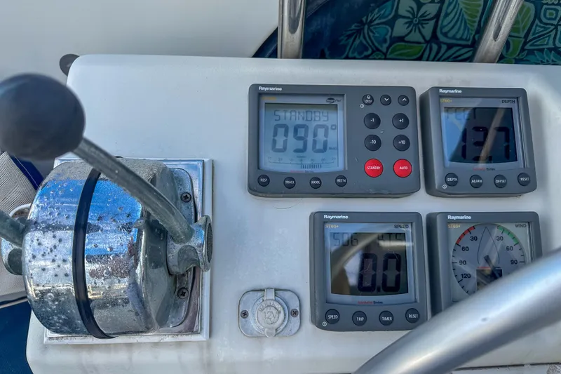 Slide: The Image of Boat control panel of a 2001 Privilege 435 with Raymarine instruments. - 10
