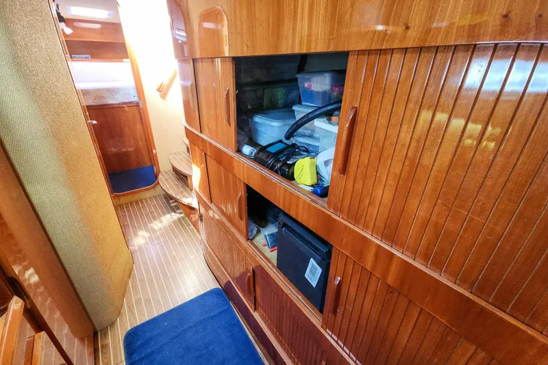 Slide: The Image of Storage area in a 2001 Privilege 435 with Dometic cooler and Brute container. - 100