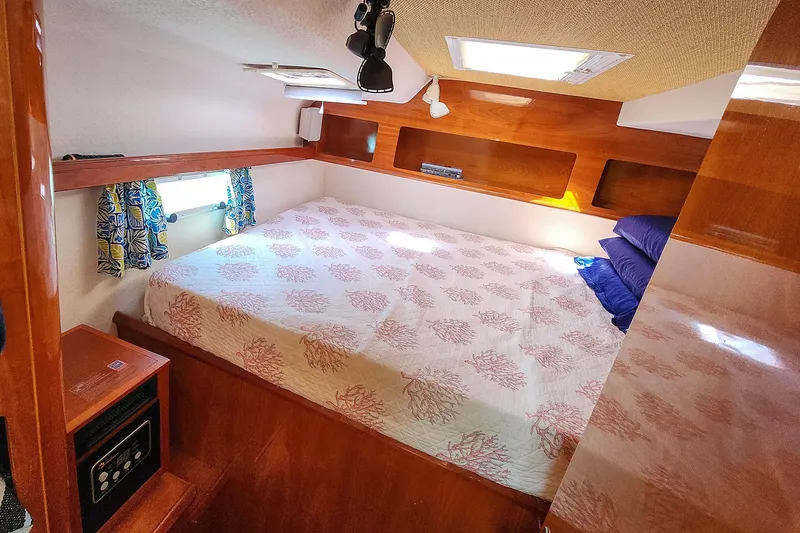 Slide: The Image of Interior hallway of 2001 Privilege 435 yacht with wooden paneling and blue carpet. - 104