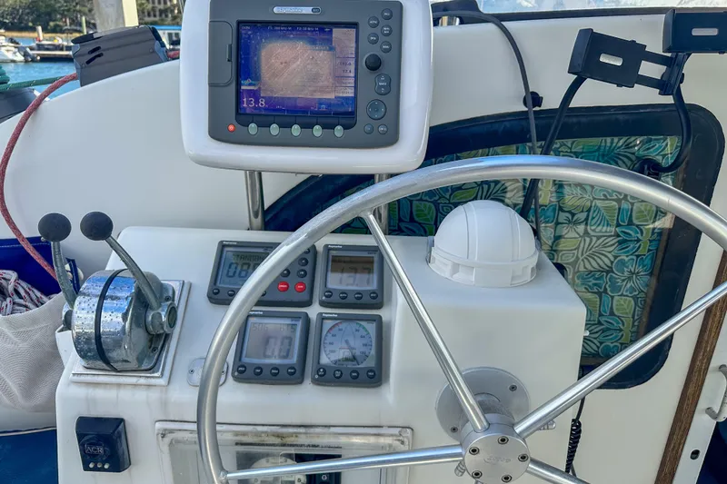 Slide: The Image of Steering wheel and navigation equipment on 2001 Privilege 435 yacht. - 11
