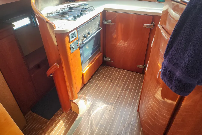 Slide: The Image of Engine room of a 2001 Privilege 435 yacht with Yanmar engine and electrical components. - 115