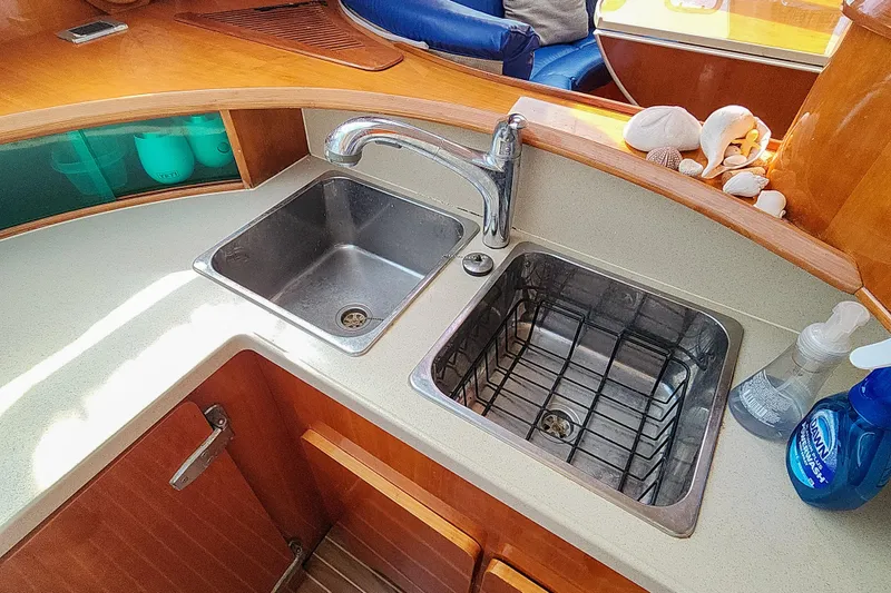 Slide: The Image of Engine compartment of a 2001 Privilege 435 yacht, showcasing mechanical components and wiring. - 121