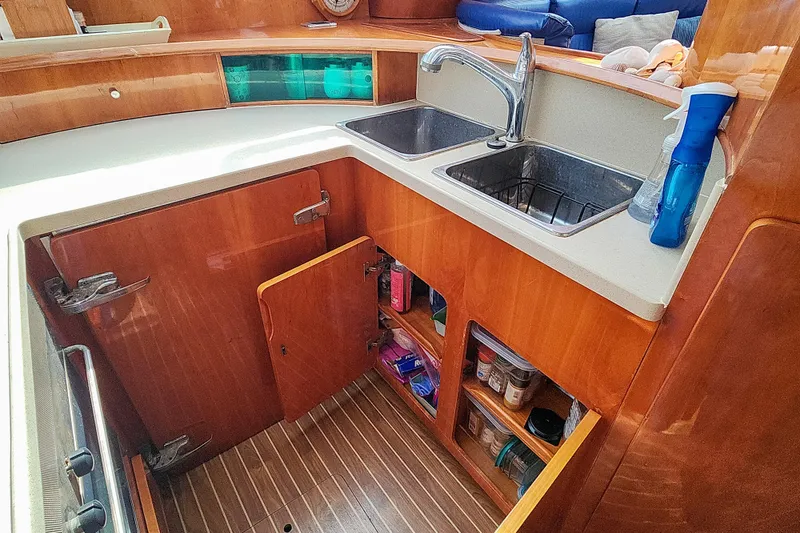 Slide: The Image of Engine compartment of a 2001 Privilege 435 yacht, showcasing mechanical components and wiring. - 122