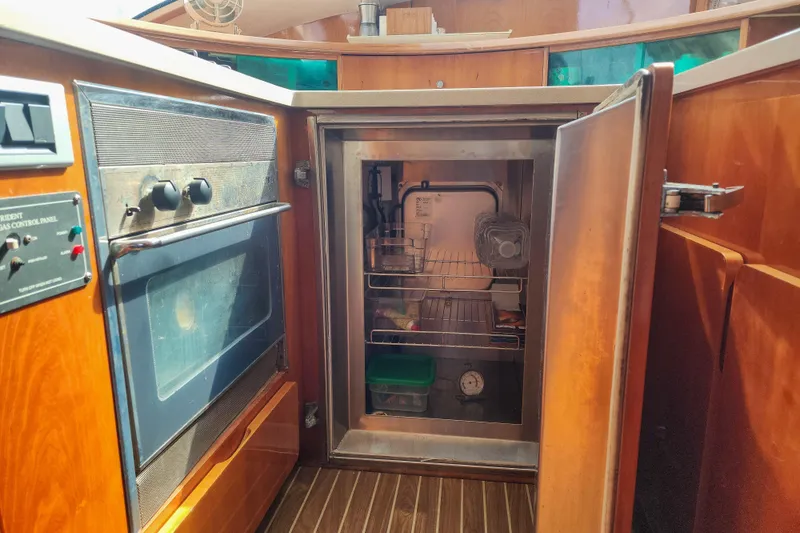 Slide: The Image of Engine compartment of a 2001 Privilege 435 yacht, showcasing detailed mechanical components. - 123