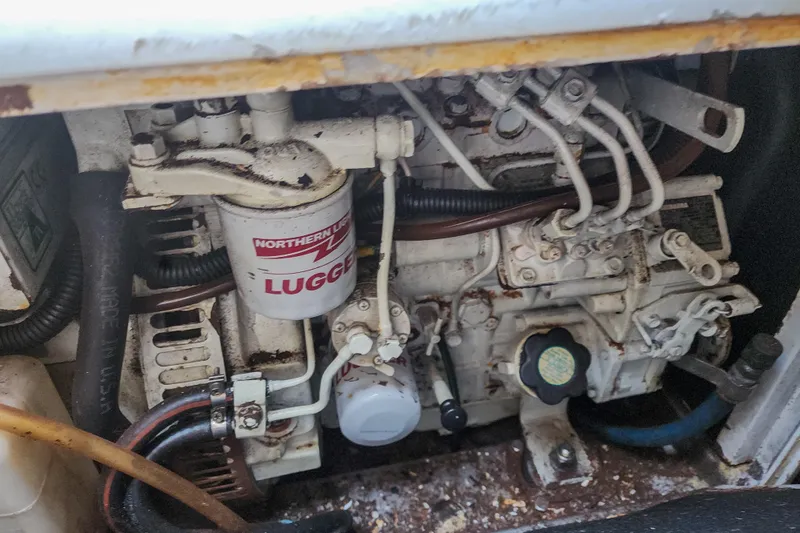 Slide: The Image of Engine compartment of a 2001 Privilege 435 yacht, featuring a Yanmar engine. - 124