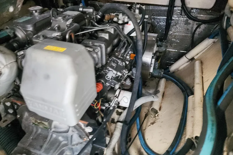 Slide: The Image of Engine compartment of a 2001 Privilege 435 yacht with marine systems equipment. - 125