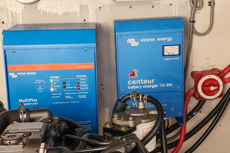 Slide: The Image of Engine compartment of a 2001 Privilege 435 yacht, featuring Northern Lights Lugger components. - 126