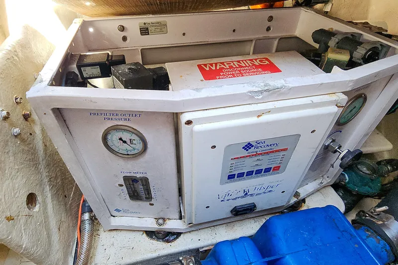 Slide: The Image of Engine room of 2001 Privilege 435 yacht with fuel filters and hoses. - 128