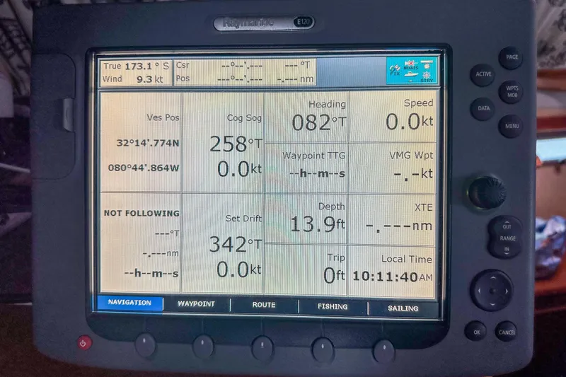 Slide: The Image of Navigation display on a Privilege 435, 2001 model, showing coordinates and sailing data. - 13
