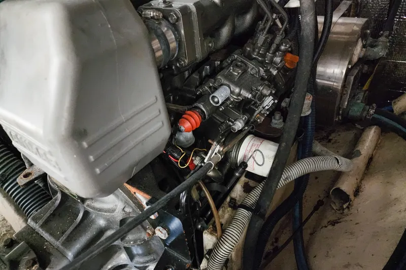 Slide: The Image of Aerial view of a 2001 Privilege 435 catamaran docked, featuring solar panels and a spacious deck. - 138