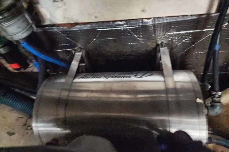 Slide: The Image of Catamaran Privilege 435, 2001 model, docked at marina with solar panels and covered cockpit. - 139