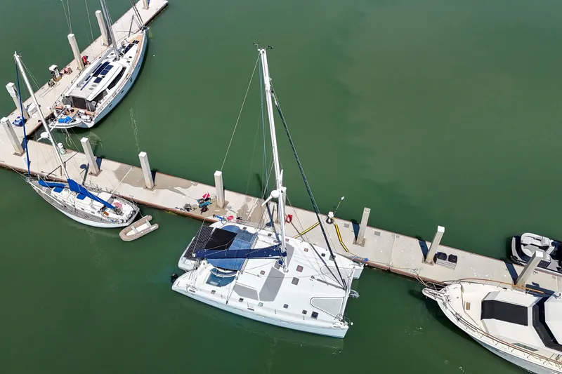 Slide: The Image of Aerial view of 2001 Privilege 435 catamaran docked in marina. - 143