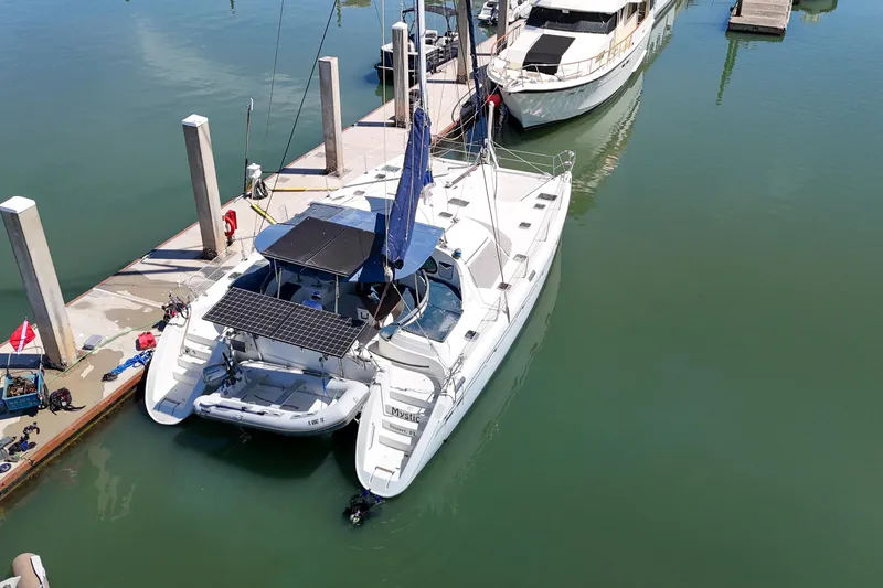 Slide: The Image of Sailing catamaran Privilege 435 from 2001 on open sea at sunset. - 153