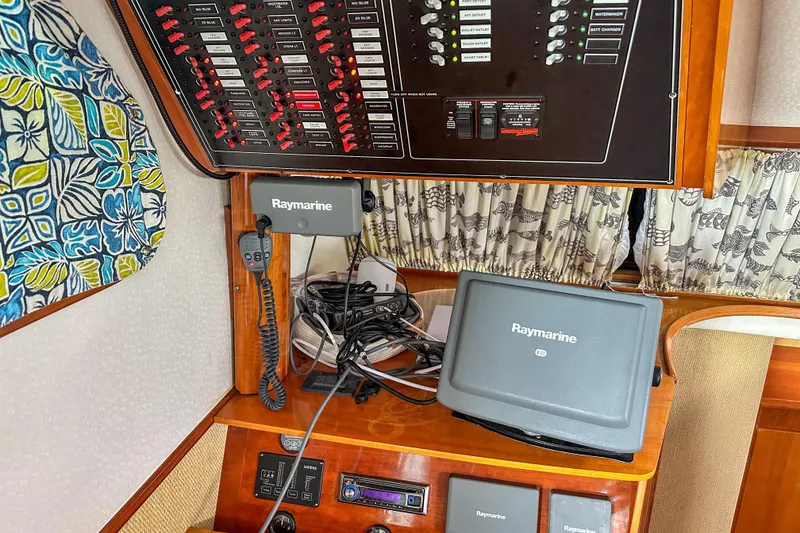 Slide: The Image of Control panel and Raymarine equipment on 2001 Privilege 435 yacht interior. - 17