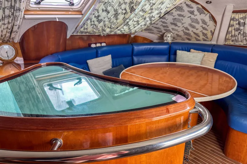 Slide: The Image of Luxurious interior of 2001 Privilege 435 yacht with blue seating and wooden table. - 19