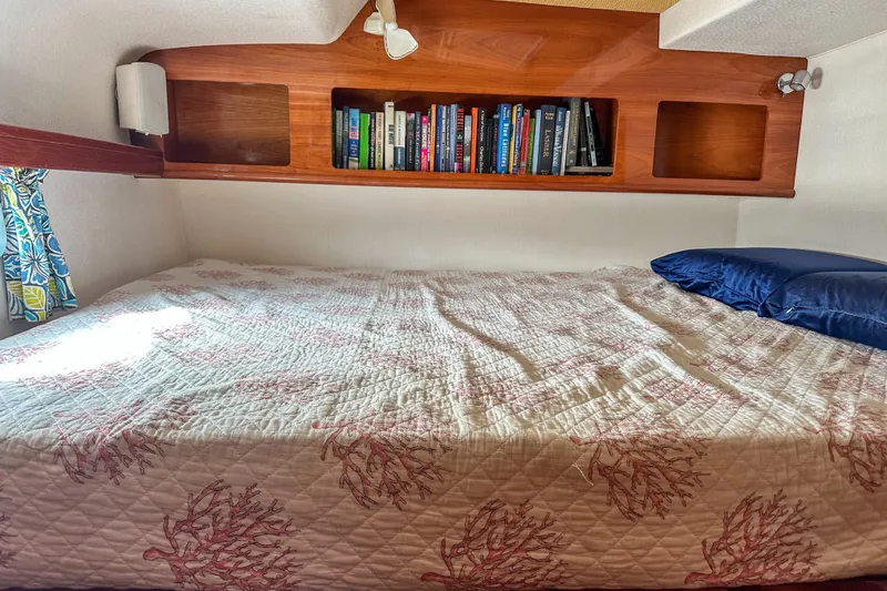 Slide: The Image of Cozy cabin bed with bookshelf in 2001 Privilege 435 yacht interior. - 23