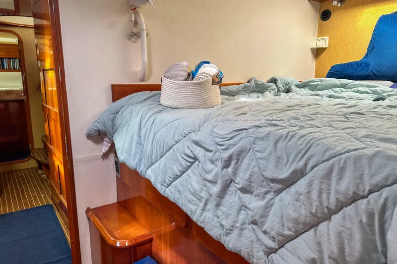 Slide: The Image of Cozy cabin interior of 2001 Privilege 435 yacht with bed and wooden accents. - 27