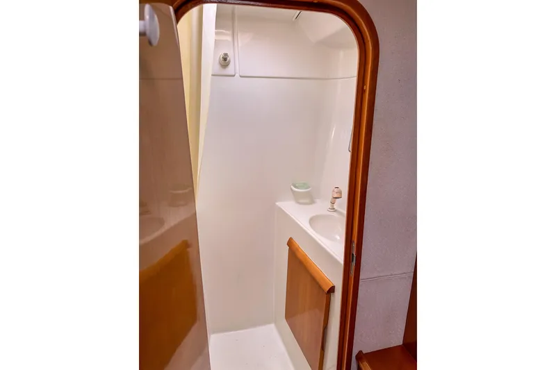 Slide: The Image of Compact bathroom interior of 2001 Privilege 435 yacht with sink and wooden accents. - 37
