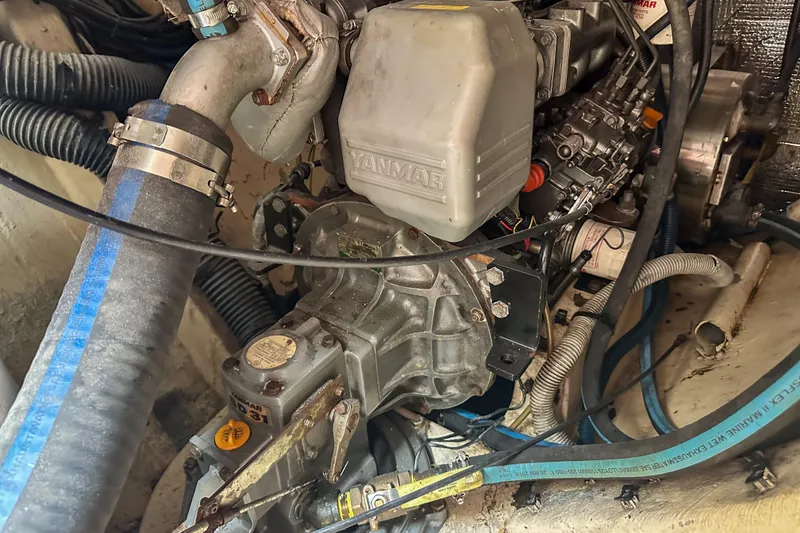 Slide: The Image of Engine compartment of a 2001 Privilege 435 yacht, featuring a Yanmar engine. - 38
