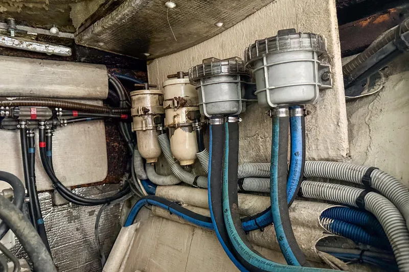 Slide: The Image of Engine room of 2001 Privilege 435 yacht with fuel filters and hoses. - 39