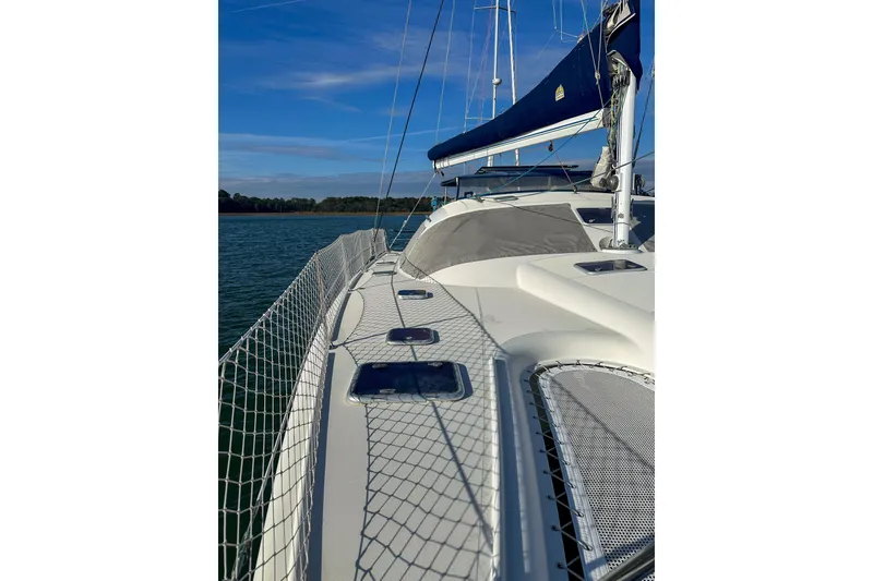 Slide: The Image of Sailing yacht Privilege 435, 2001 model, on calm waters under a clear blue sky. - 5