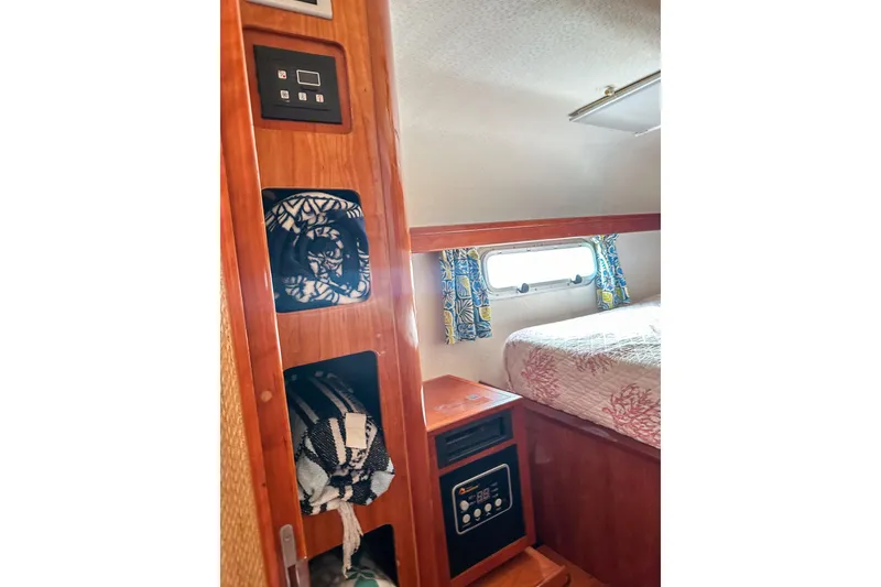 Slide: The Image of Blue cushioned stools and seating in a 2001 Privilege 435 yacht interior. - 57