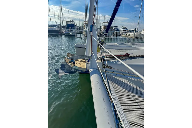 Slide: The Image of Catamaran Privilege 435, 2001 model, docked in a marina with clear skies. - 6