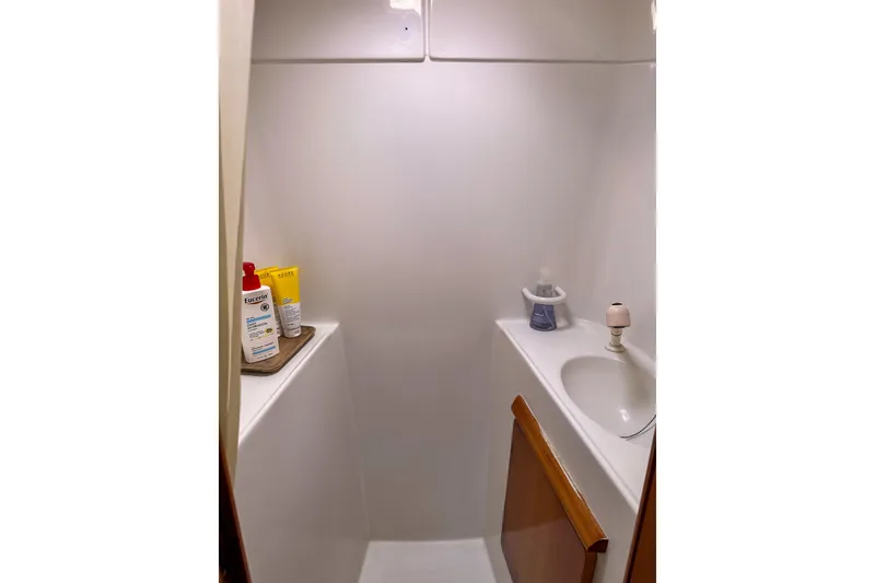 Slide: The Image of Kitchen sink area on a 2001 Privilege 435 yacht, featuring dual basins and decorative seashells. - 63