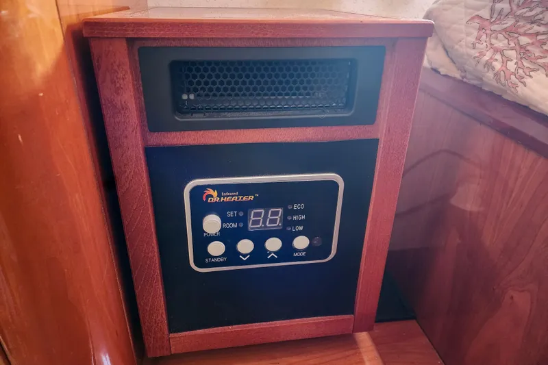 Slide: The Image of Cozy cabin bedroom in 2001 Privilege 435 yacht with wooden accents and patterned bedding. - 74