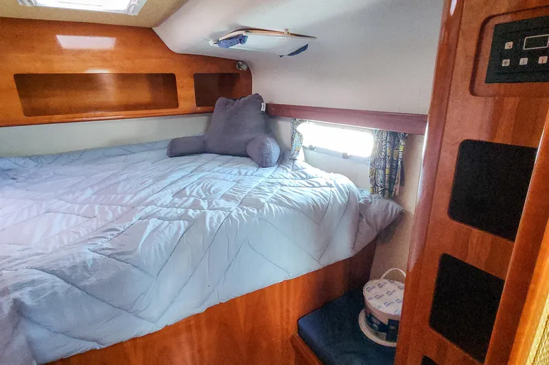 Slide: The Image of Luxurious wooden interior of 2001 Privilege 435 yacht hallway with storage and seating. - 81