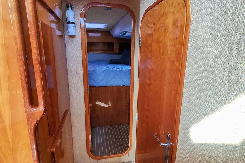 Slide: The Image of Cozy cabin interior of 2001 Privilege 435 yacht with bed and wooden accents. - 85
