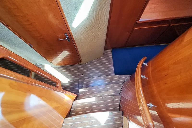 Slide: The Image of Interior of 2001 Privilege 435 yacht with wooden cabinetry and stove. - 91