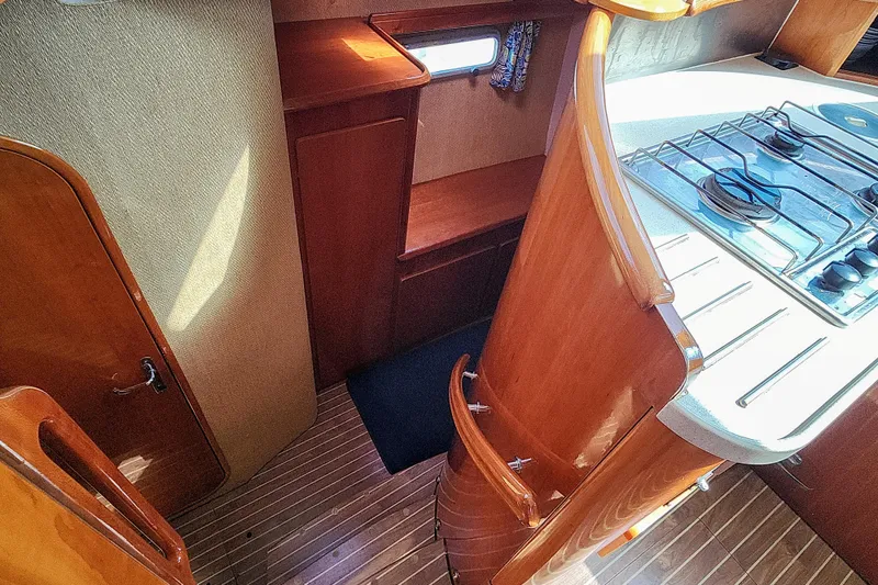 Slide: The Image of Interior of 2001 Privilege 435 yacht with polished wood and elegant design. - 92