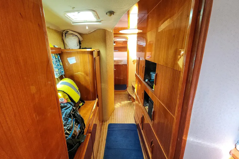 Slide: The Image of Interior of 2001 Privilege 435 yacht with wooden cabinetry and nautical decor. - 93