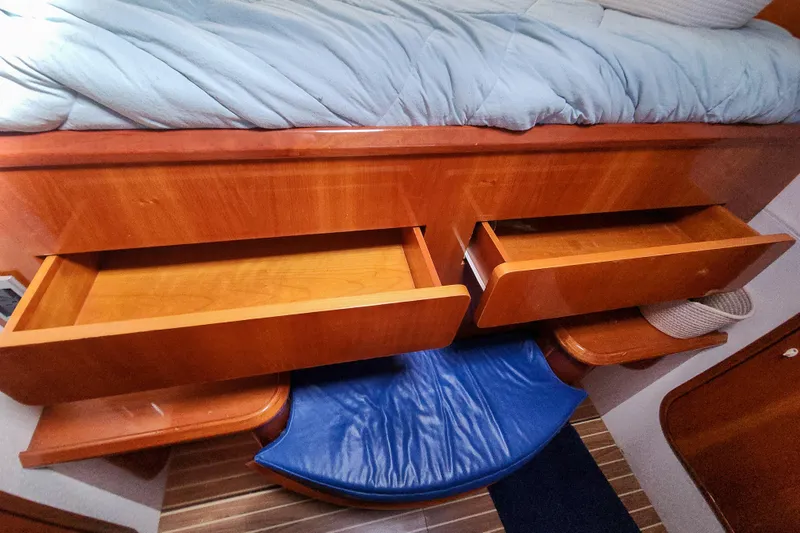 Slide: The Image of Interior of 2001 Privilege 435 yacht with wooden cabinetry and blue seating. - 94