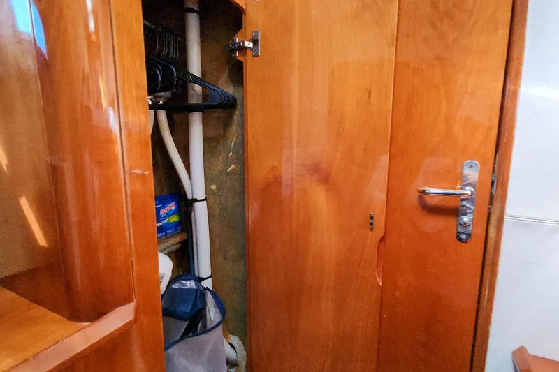 Slide: The Image of Stainless steel storage compartments inside a 2001 Privilege 435 yacht. - 95